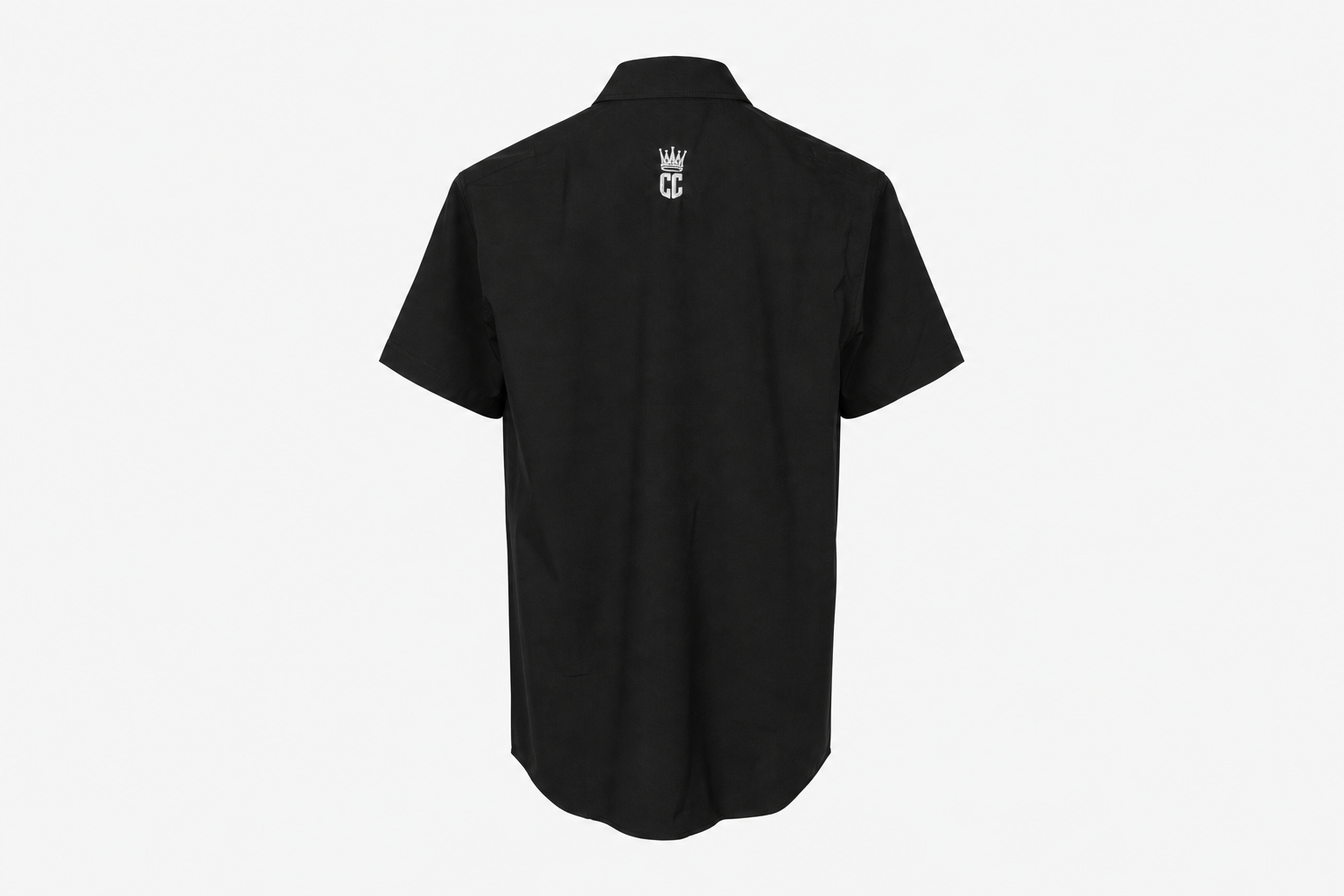 A black short-sleeve button-up shirt shown from the back, featuring a small white crown and 'CC' monogram logo centered on the upper back, set against a plain light gray background.