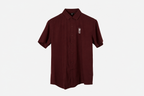 A maroon short-sleeve button-up shirt with a small white crown and 'M' logo on the left chest, displayed on a clean white background.